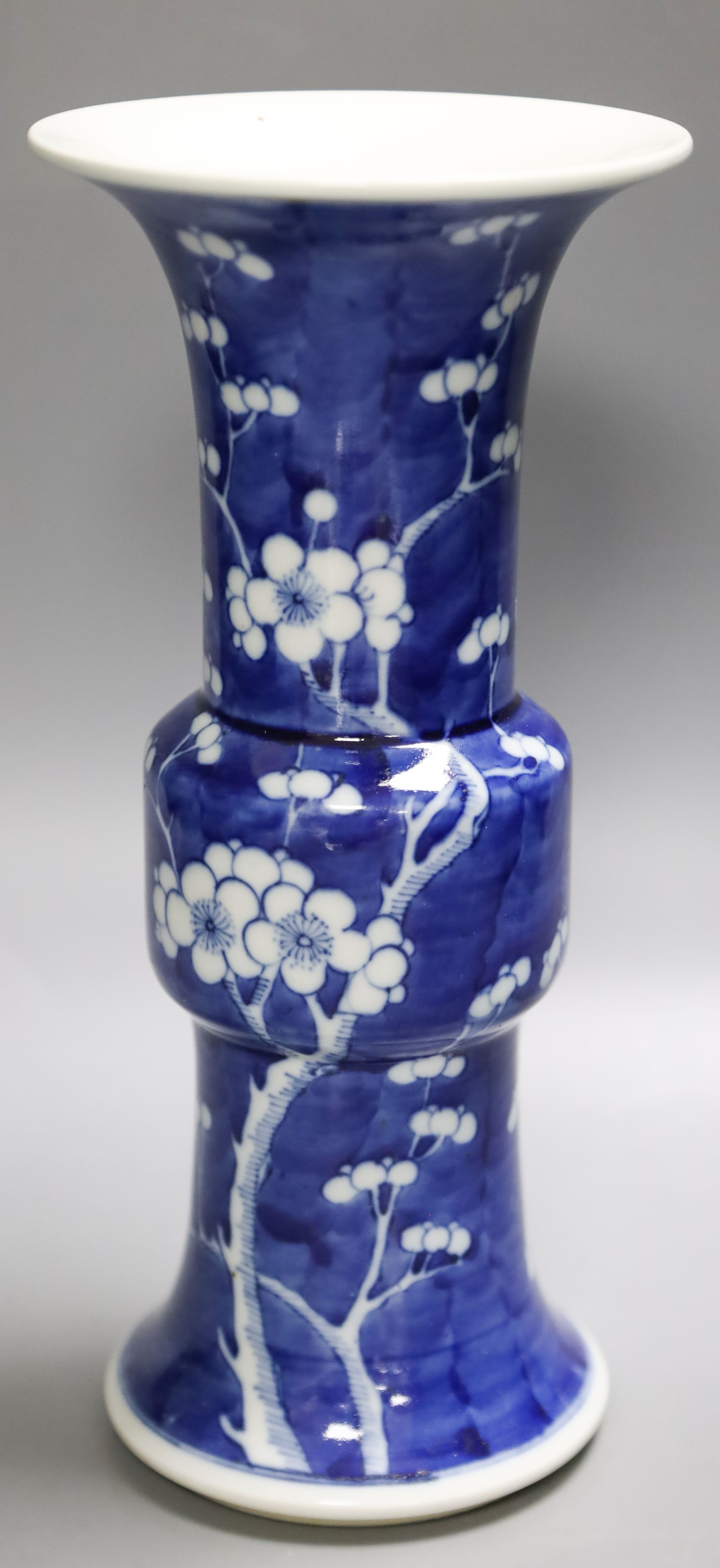 A Chinese blue and white prunus decorated gu vase, 26.5cm